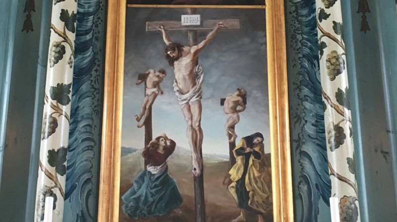 Utsnitt fra altertavlen i Lunde kirke i Nordre Land. Altertavlen er malt av Peder Aadnes, en av 1700-tallets meste kjente bygdemalere. Aadnes var fra Odnes i Søndre Land. Foto: Britt Agnethe Enemo.